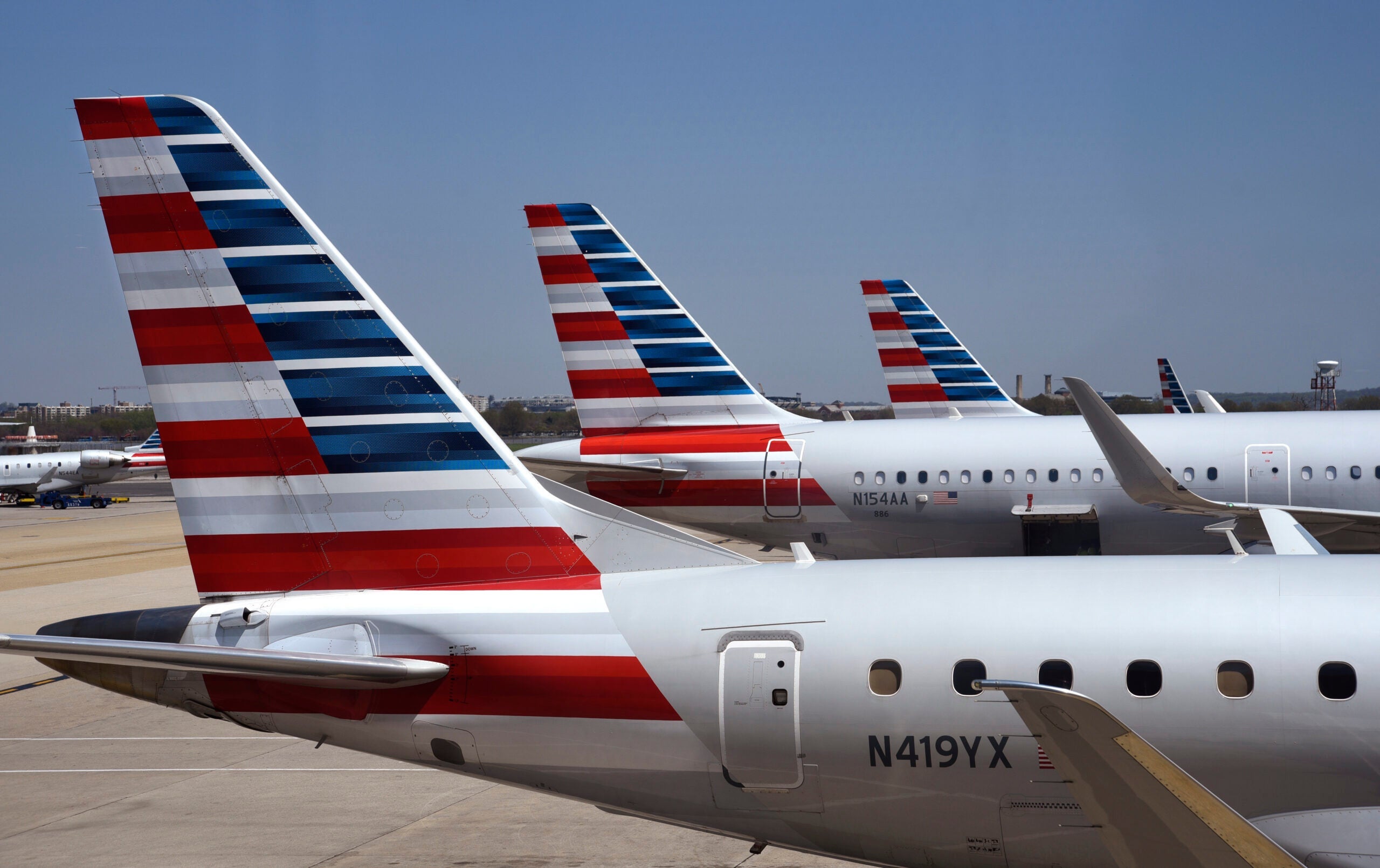 Tails of American Airlines planes are seen at Washington National Airport.