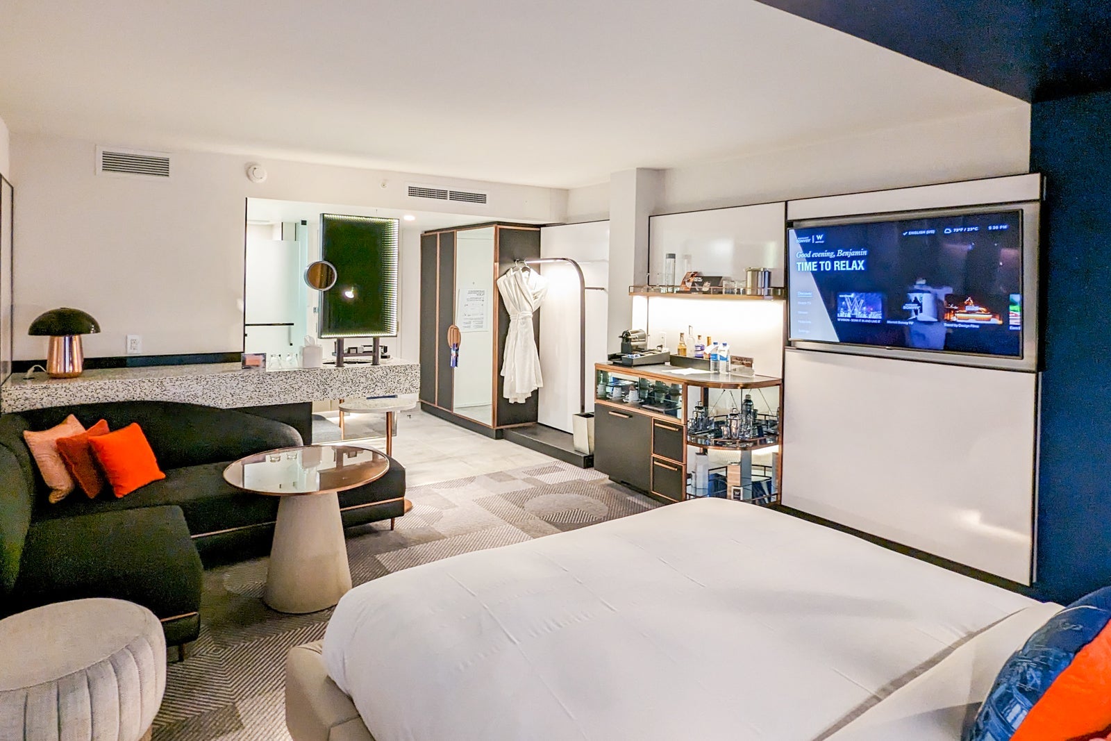 modern hotel room with wall TV