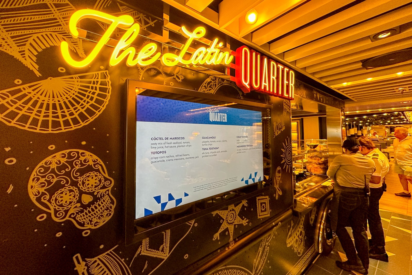 A close-up of an indoor food truck in the food court on a cruise ship