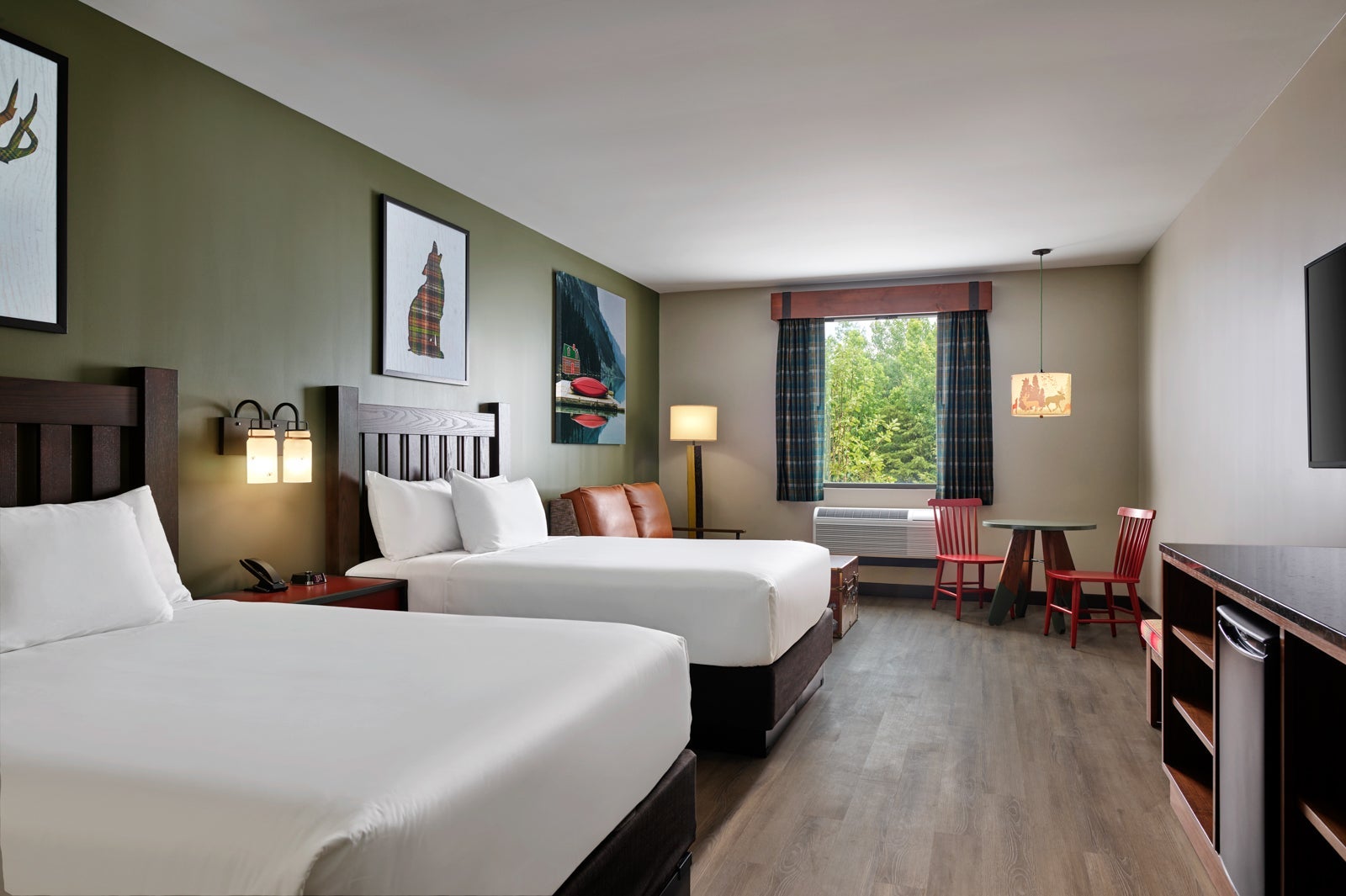 Standard suite with two queen beds, sofa and dining table at Great Wolf Lodge
