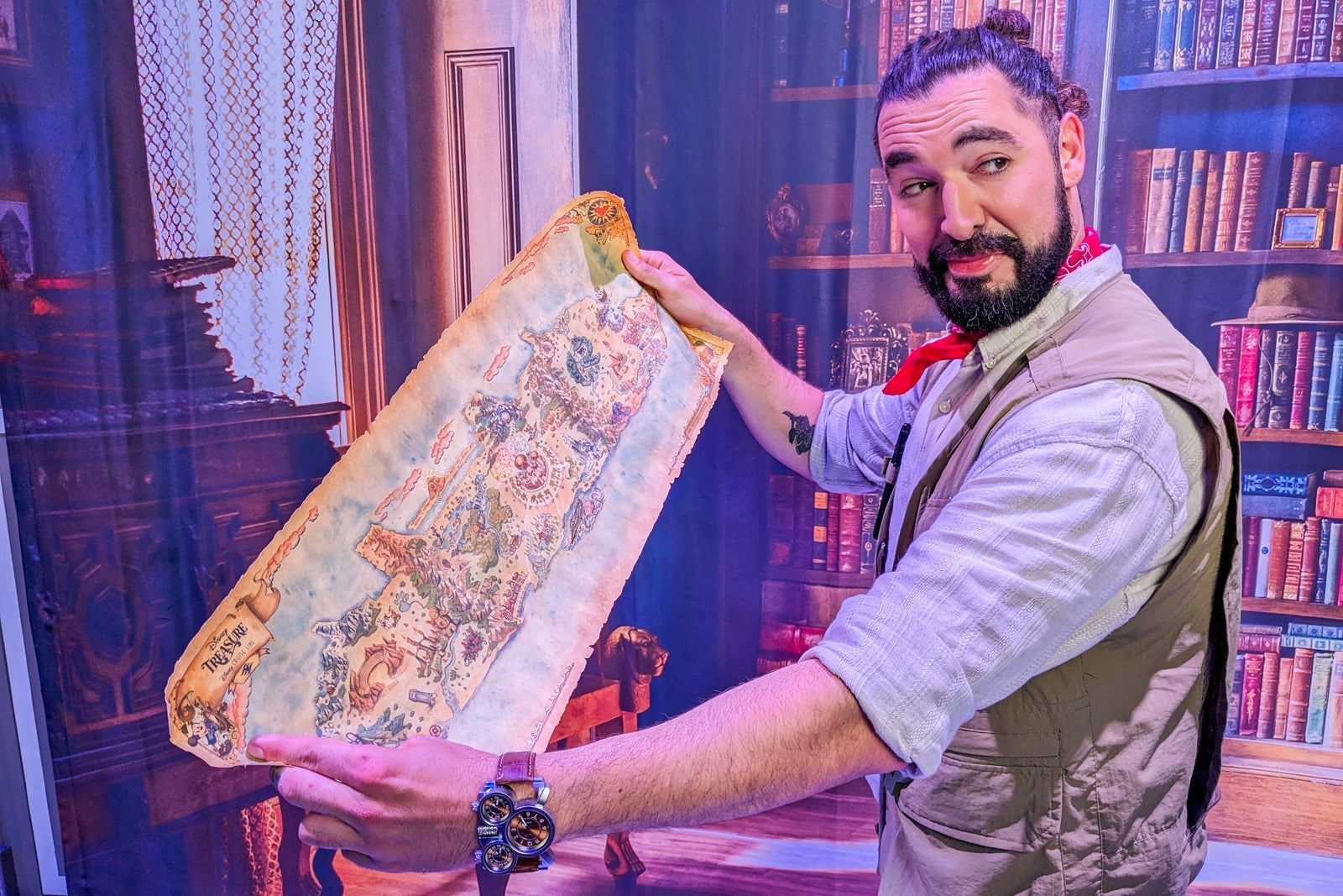 Arthur Quinn, Disney Treasure's resident explorer, peruses a treasure map.