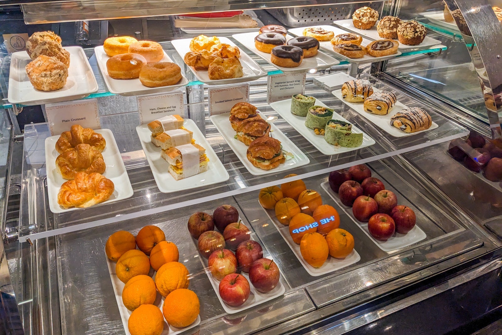 Fruit and mini sandwiches in display case