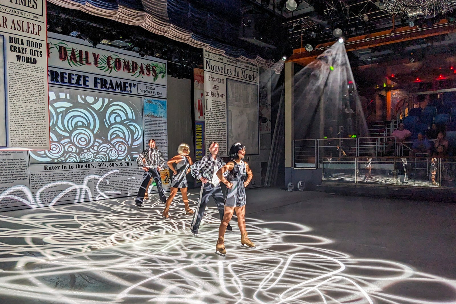 Ice skaters perform on an ice skating rink in Studio B on Independence of the Seas.