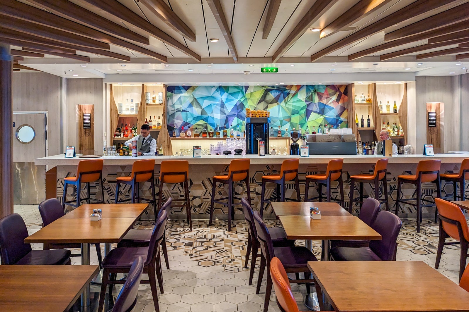 A bartender makes a drink at the Plaza Bar on Independence of the Seas.