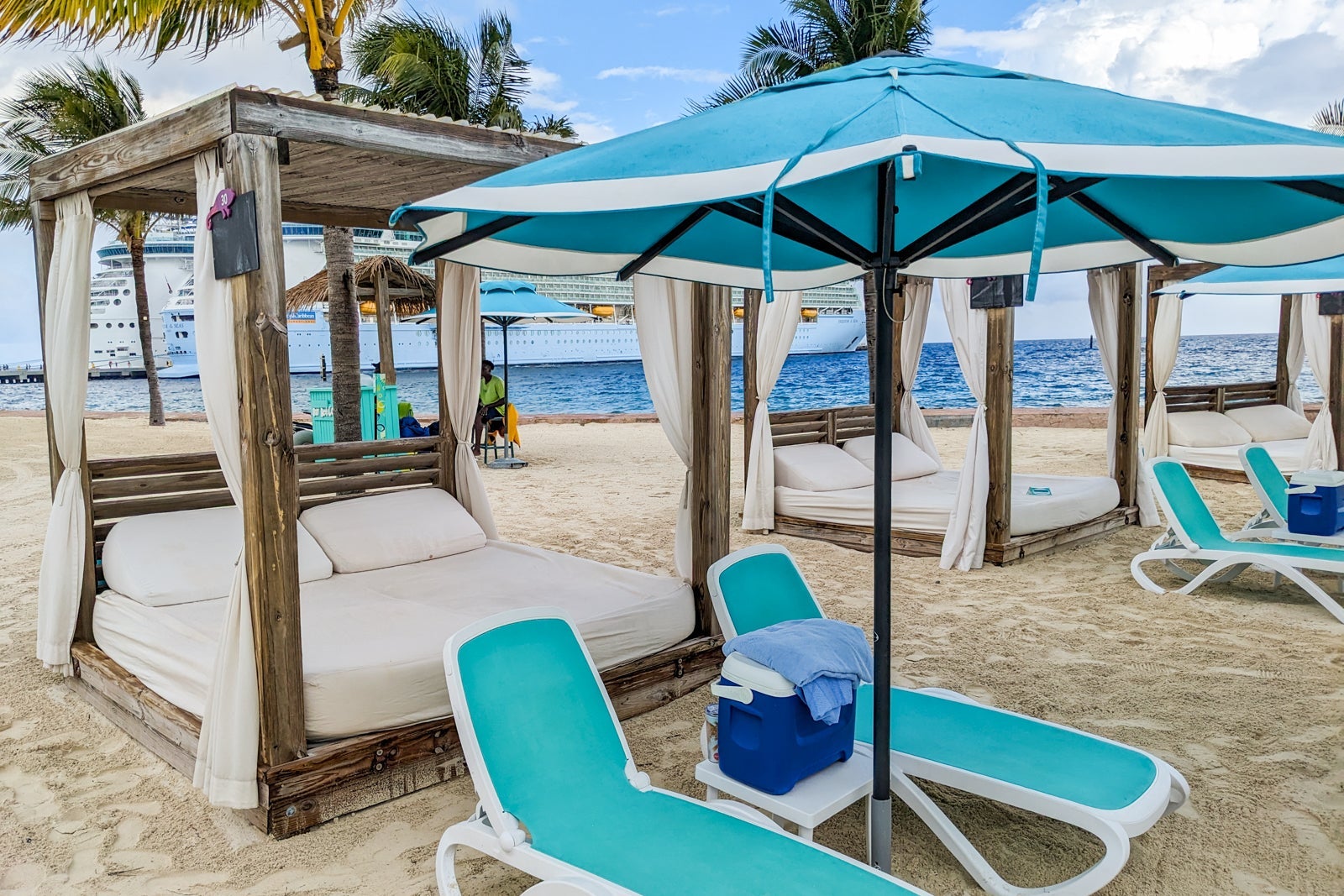 Day bed on the beach with lounge chairs