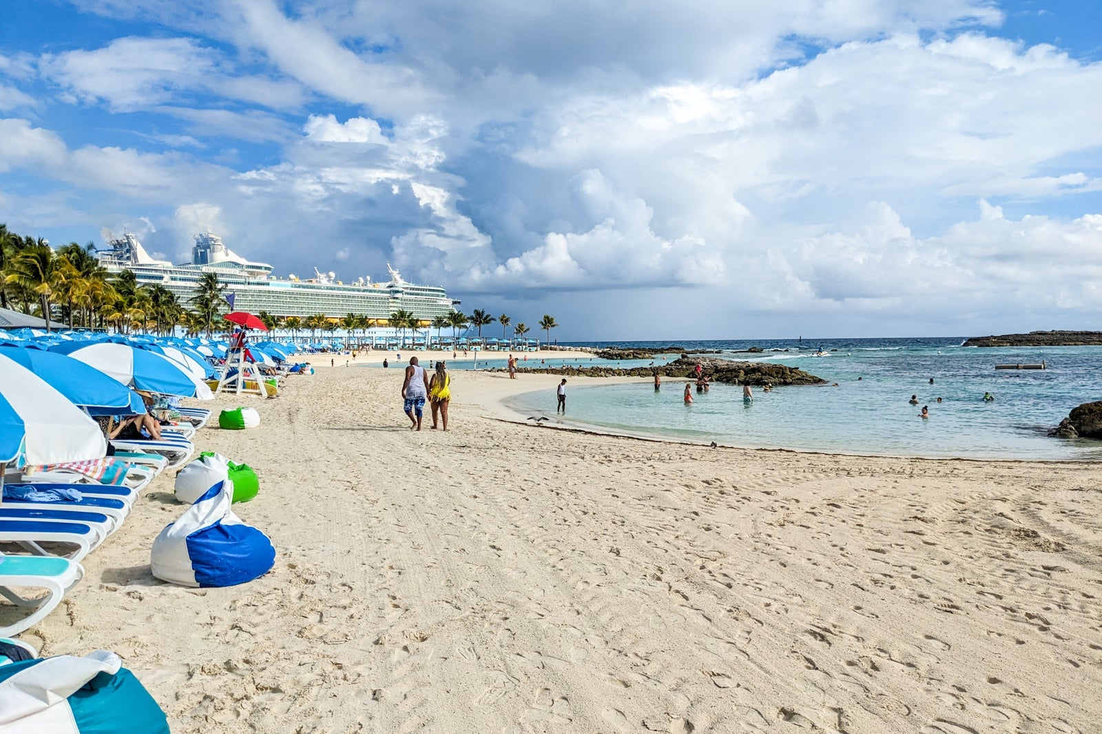 Sheltered beaches with cruise ship in the background.