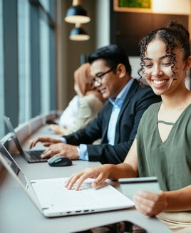 People working on laptops together
