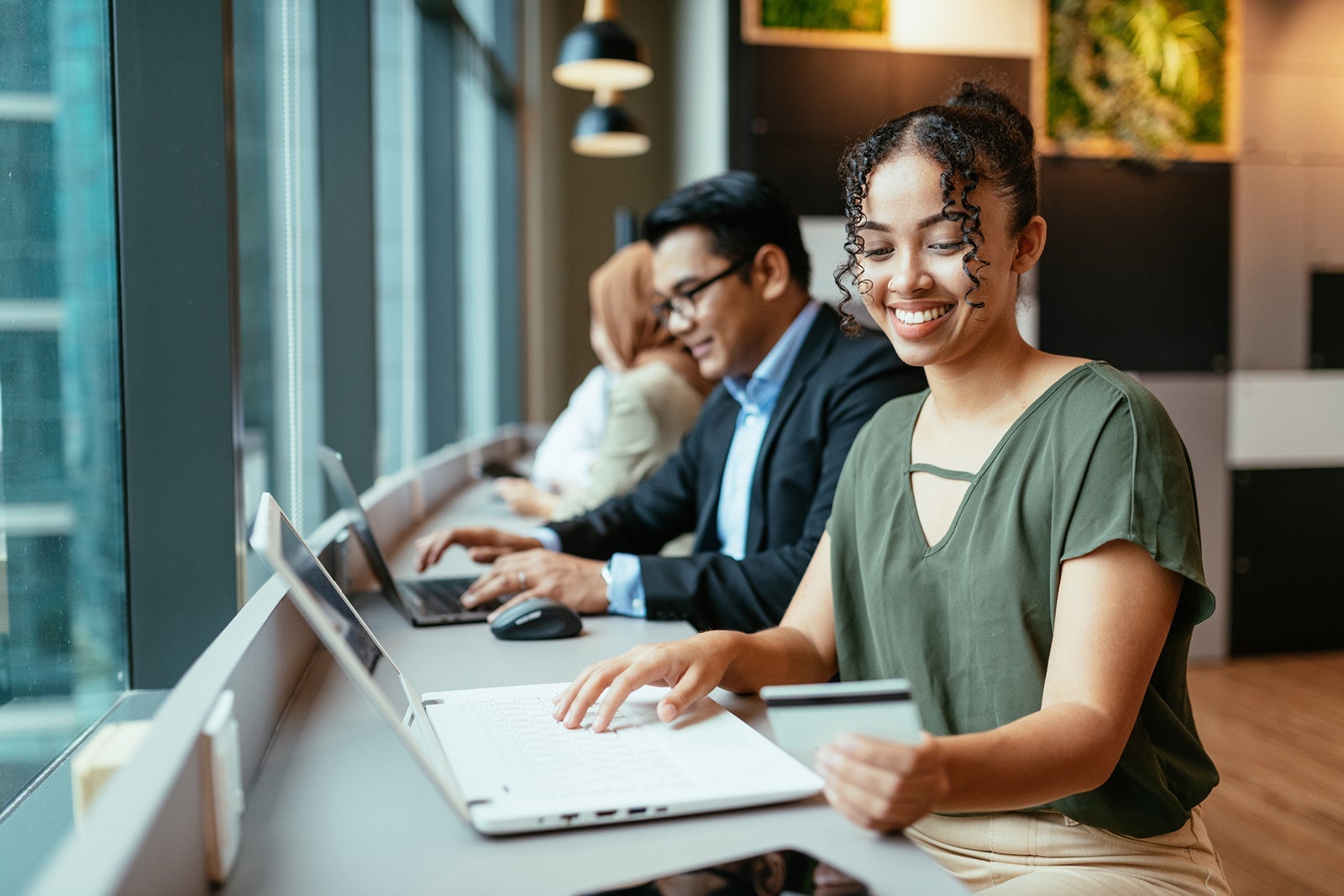 People working on laptops together