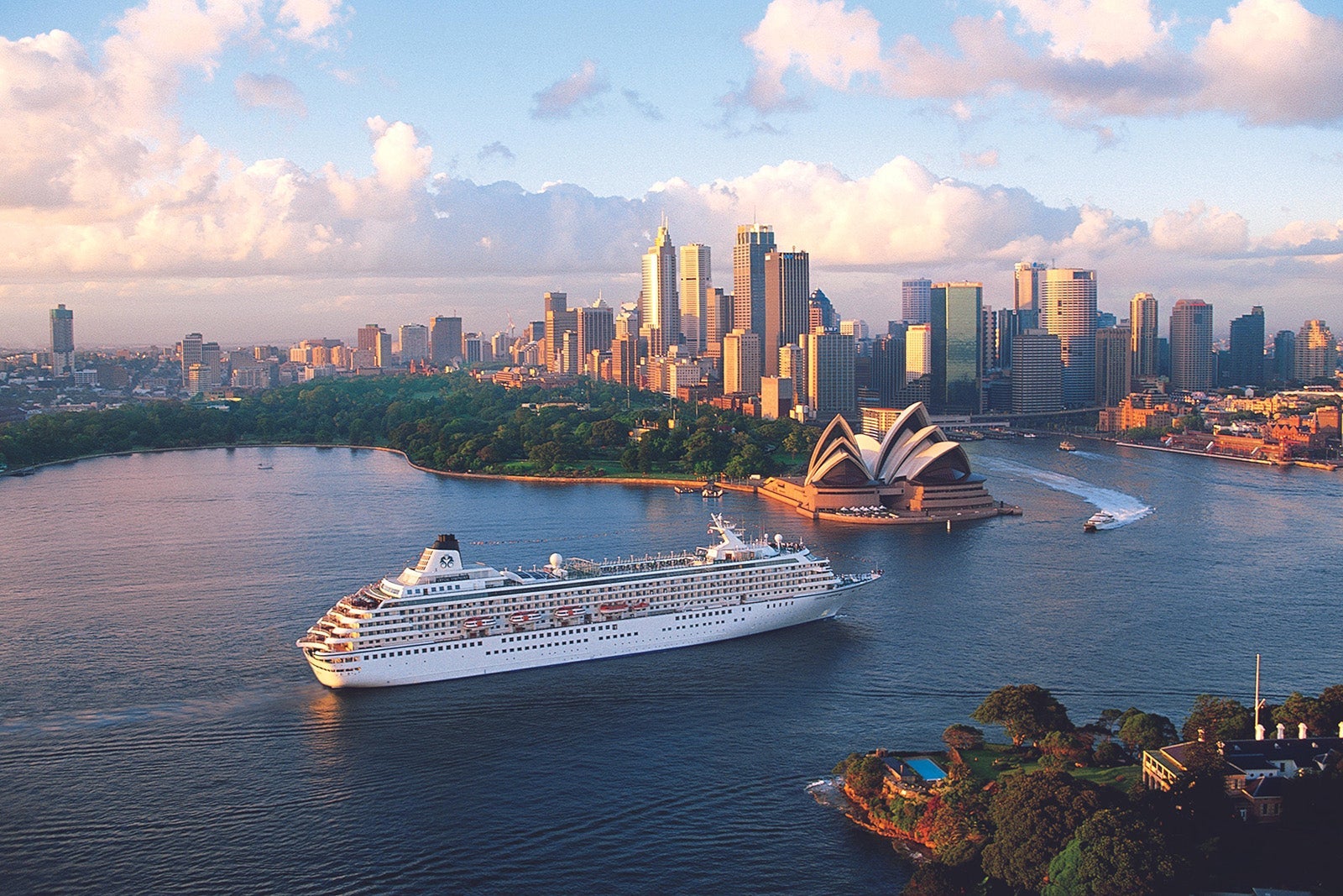 An aerial view of a cruise ship near the Sydney Opera House in Australia