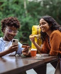 Young woman using e-commerce services on a city break