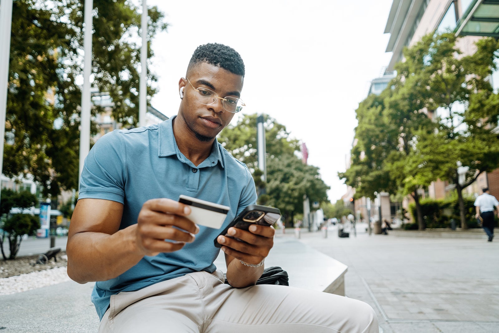 Man looking at a credit card
