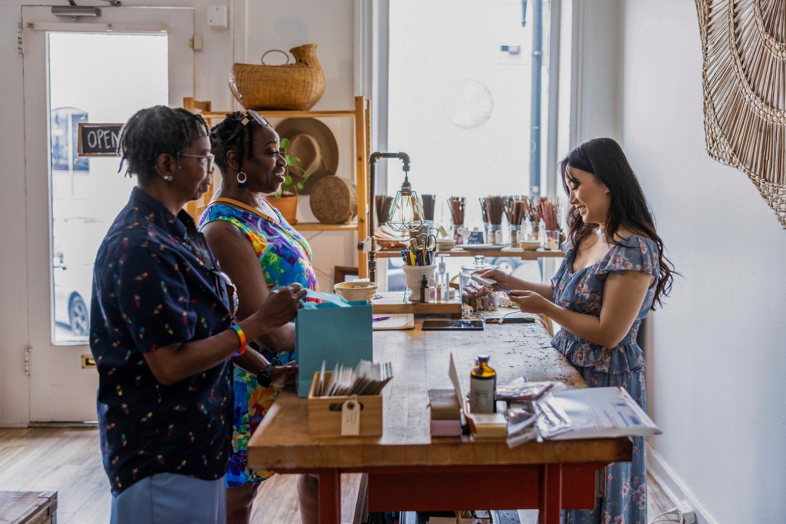 Lesbian couple making a purchase at a female owned small business