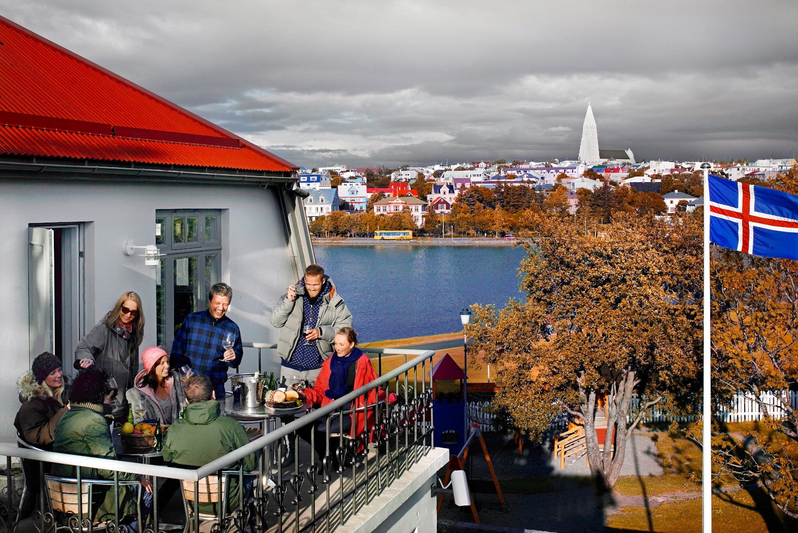 People enjoying food and drink on a patio in Reykjavik, Iceland