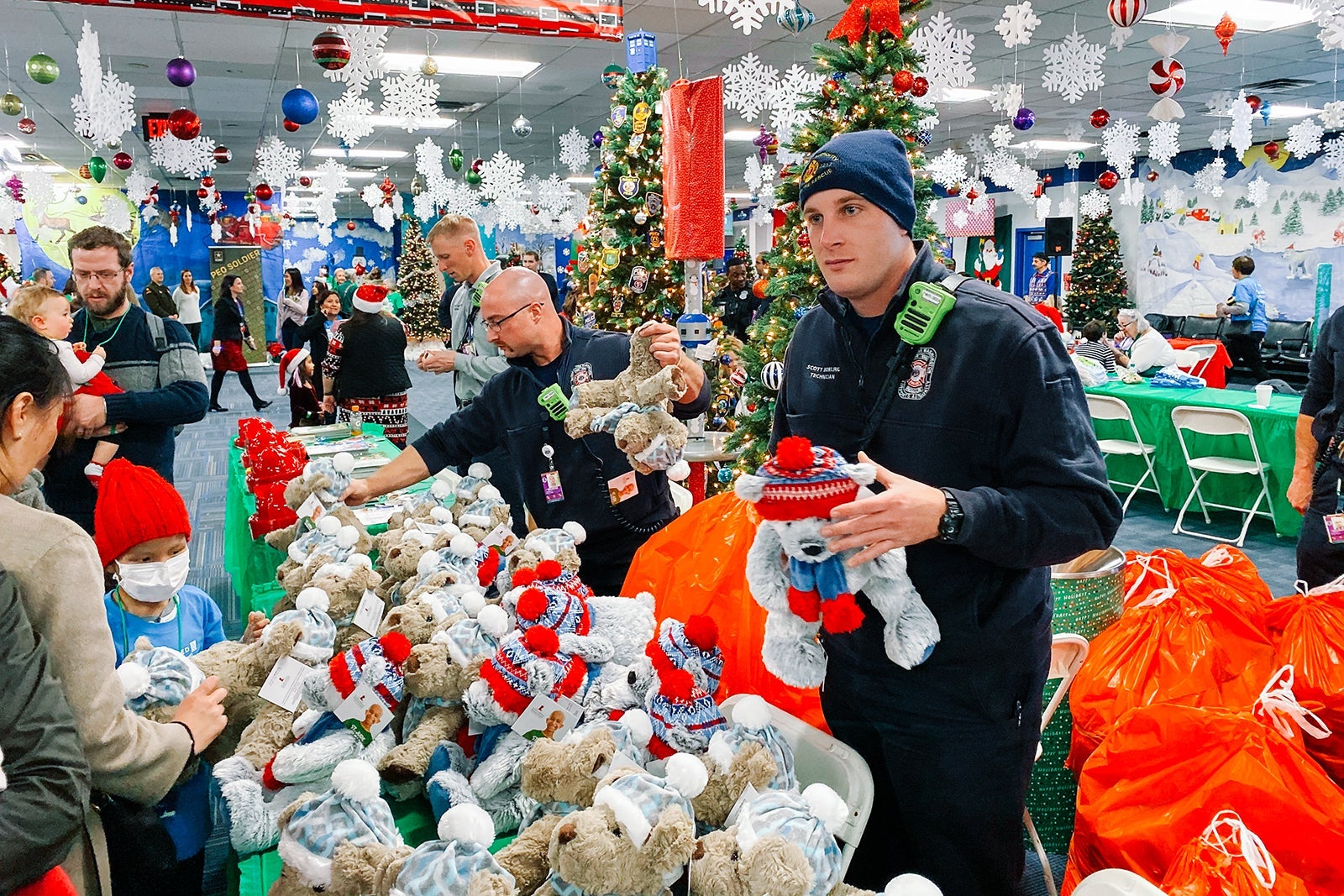 Workers hand out toys for the Flight to the North Pole