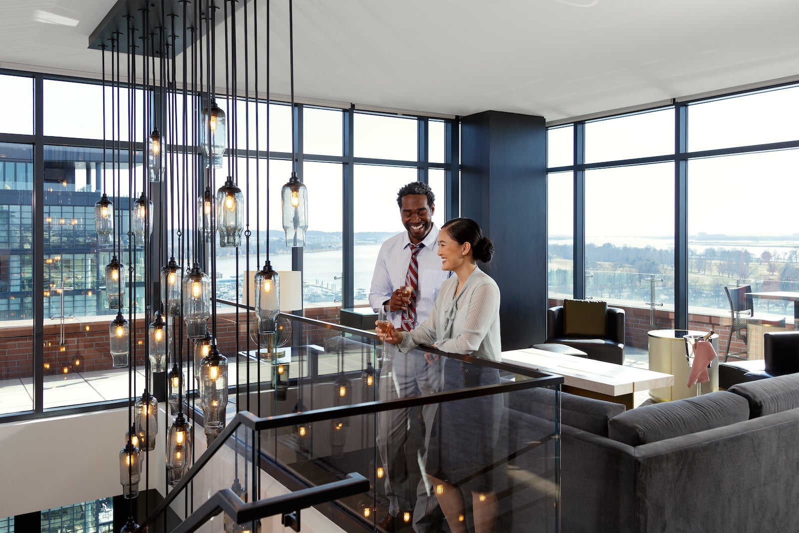 A businessman and businesswoman having a drink in a hotel