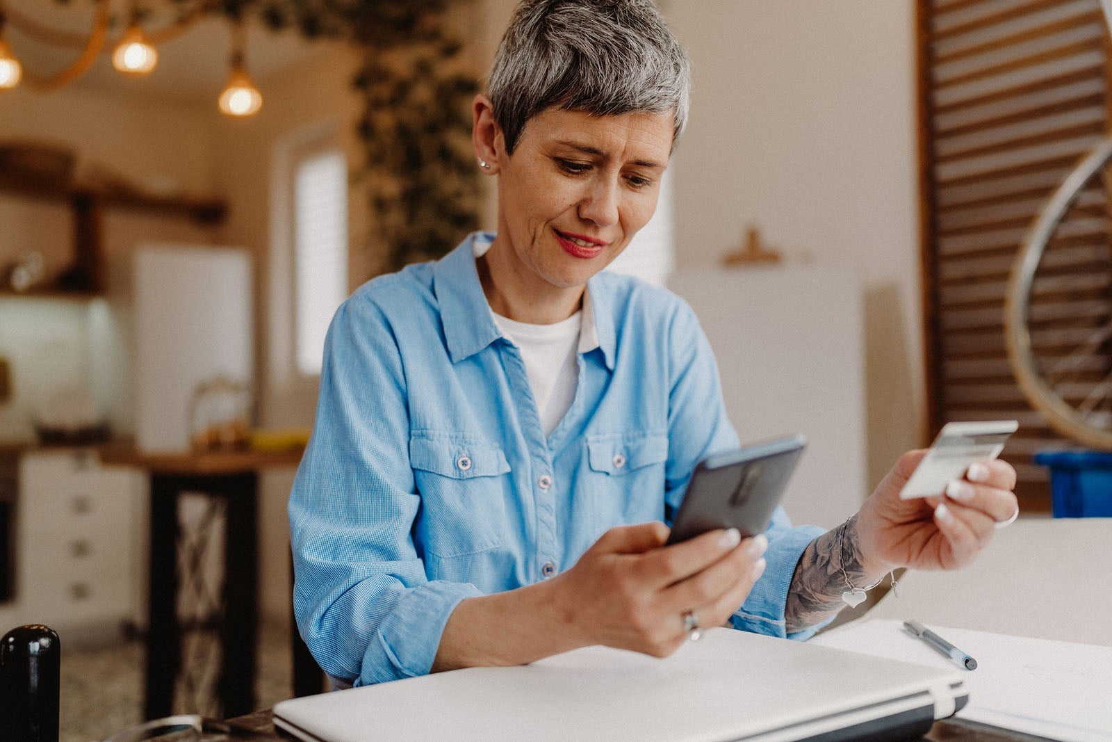 Woman using her phone with a card