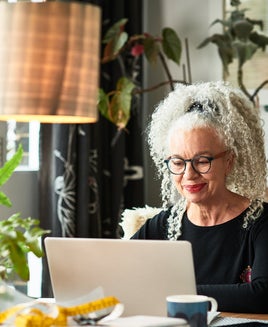 Woman using a laptop at home