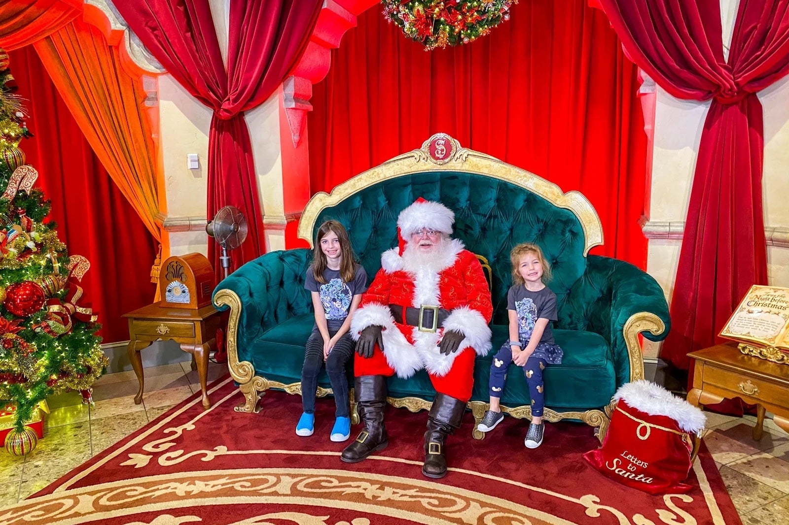 Kids posing with Santa at Disney Christmas