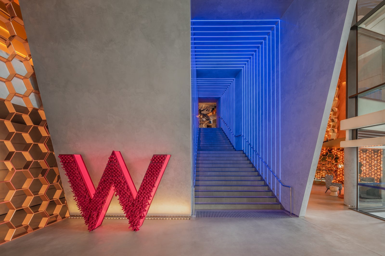 The grand entrance to the W Sydney hotel featuring a large red W