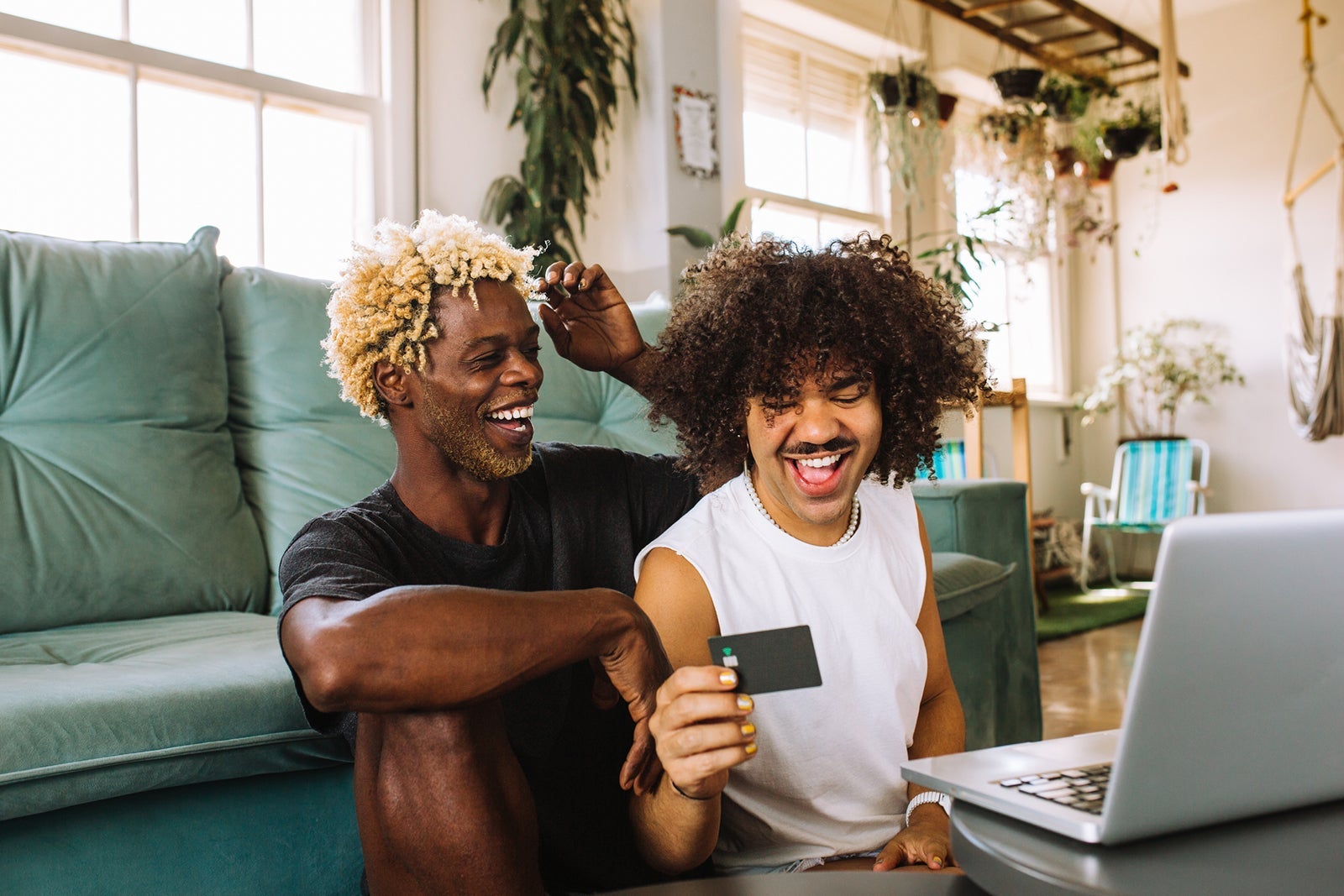 young couple online shopping using credit card