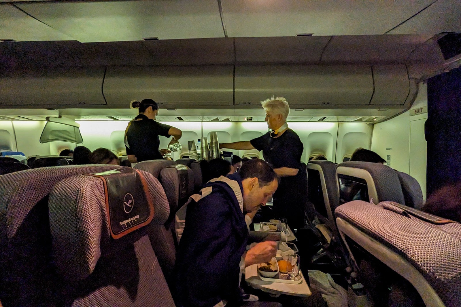 flight attendants serving meal
