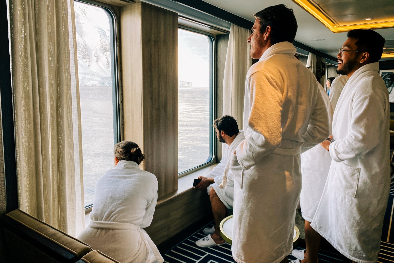 Passengers wait in robes to take a polar plunge