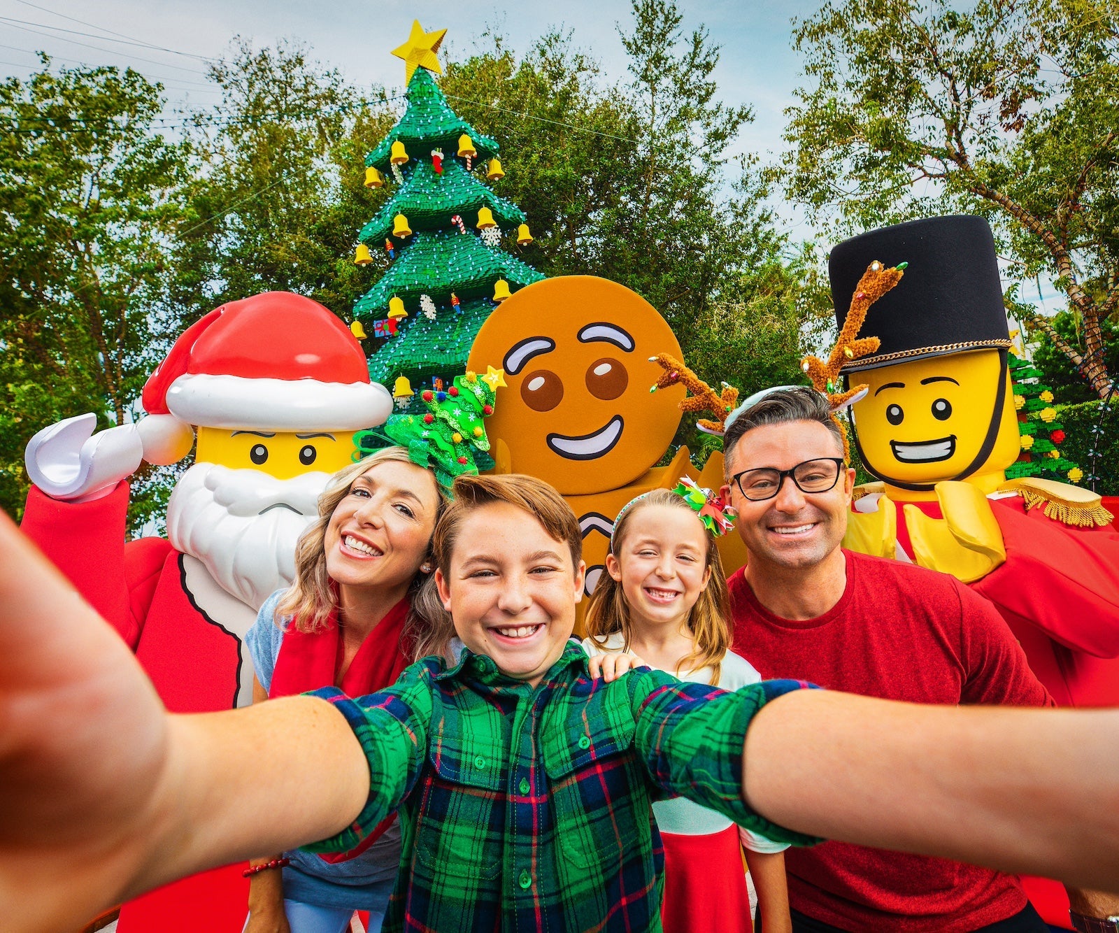 A family posing for a holiday photo at Legoland Florida