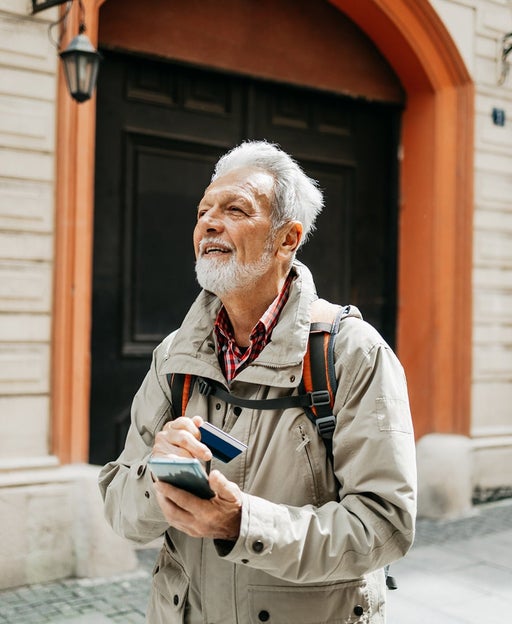 Man holding card while traveling