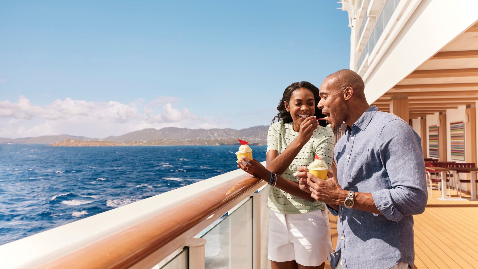 A couple eating ice cream on a Norwegian Cruise Line ship
