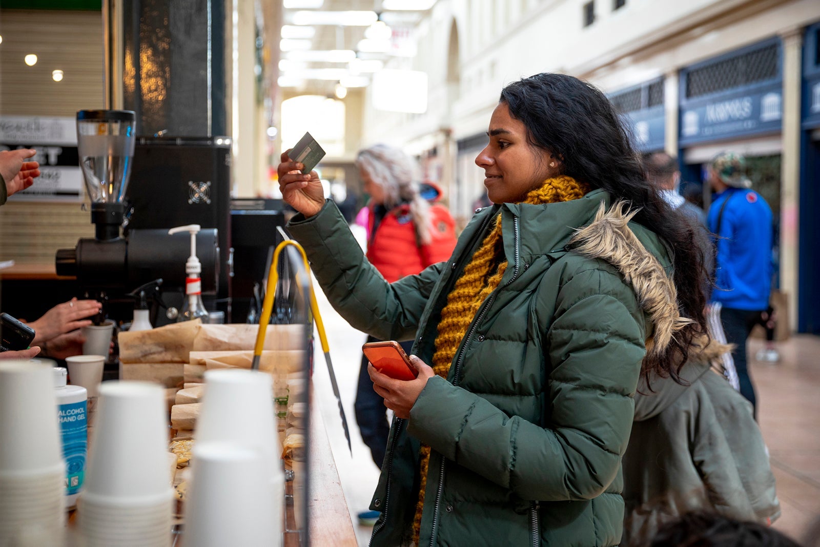 Woman paying for coffee