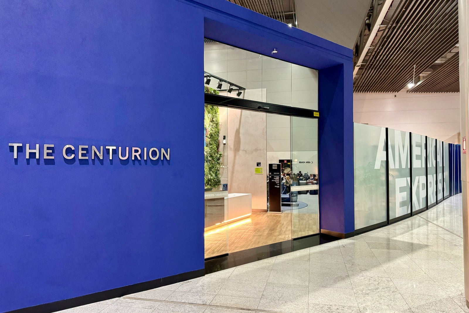 the entrance to an Amex Centurion Lounge in an airport