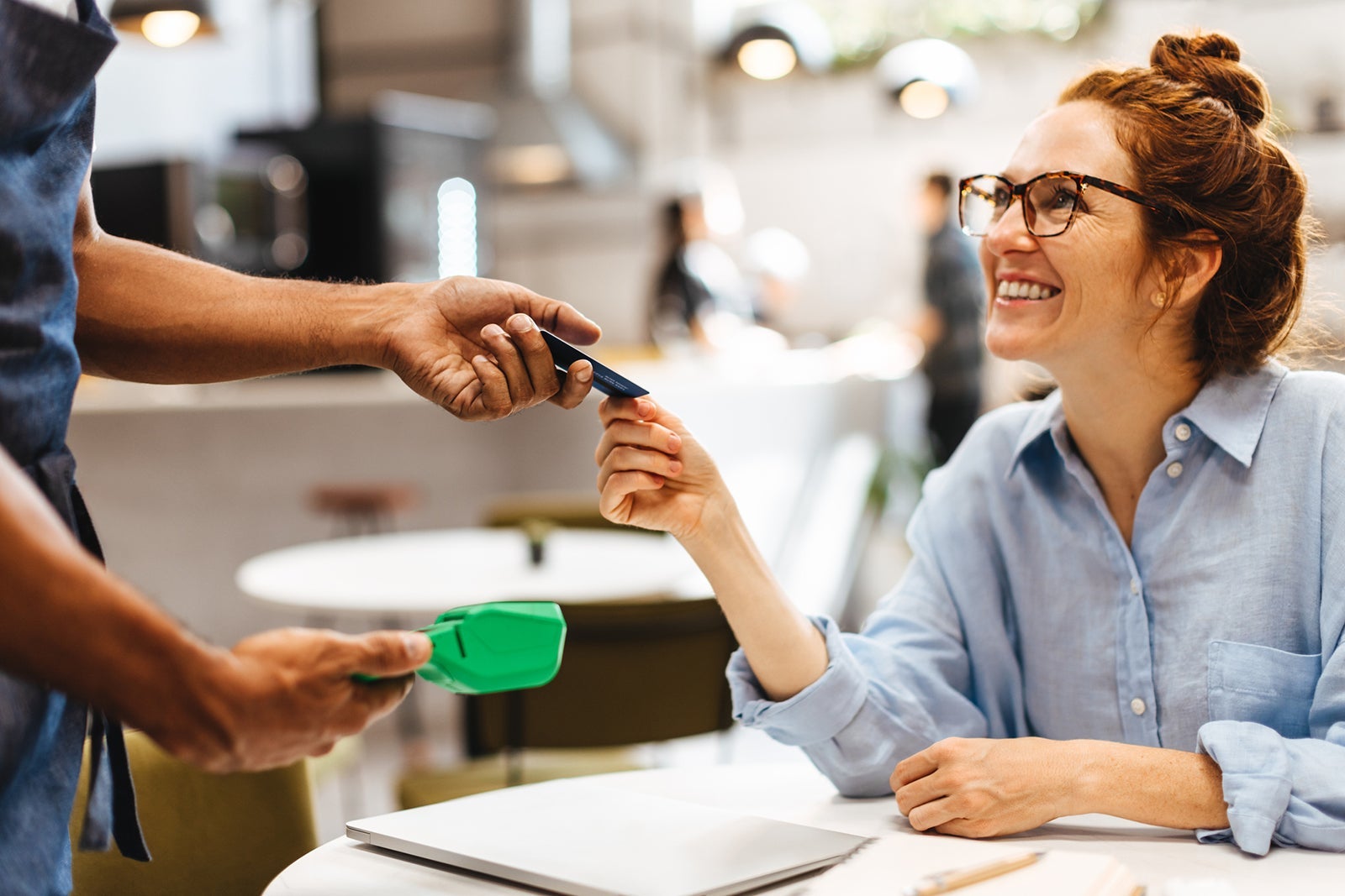 Woman paying for a meal