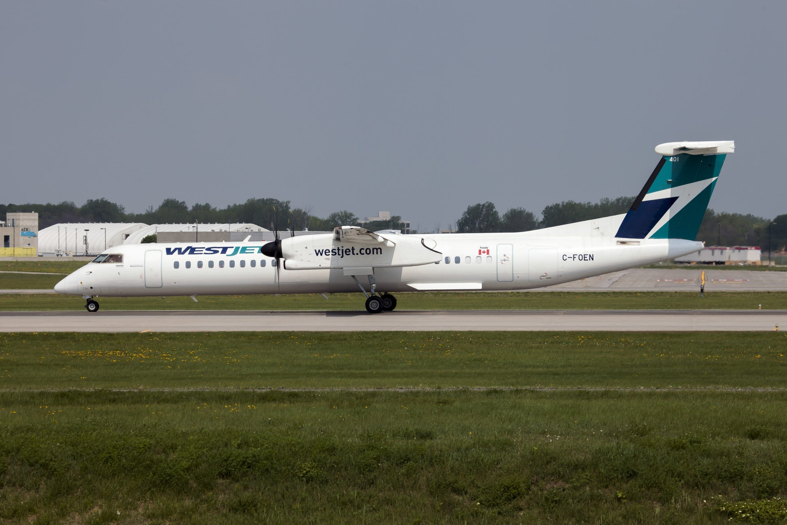 A WestJet Encore Bombardier Dash 8-Q400 landing at Montreal.