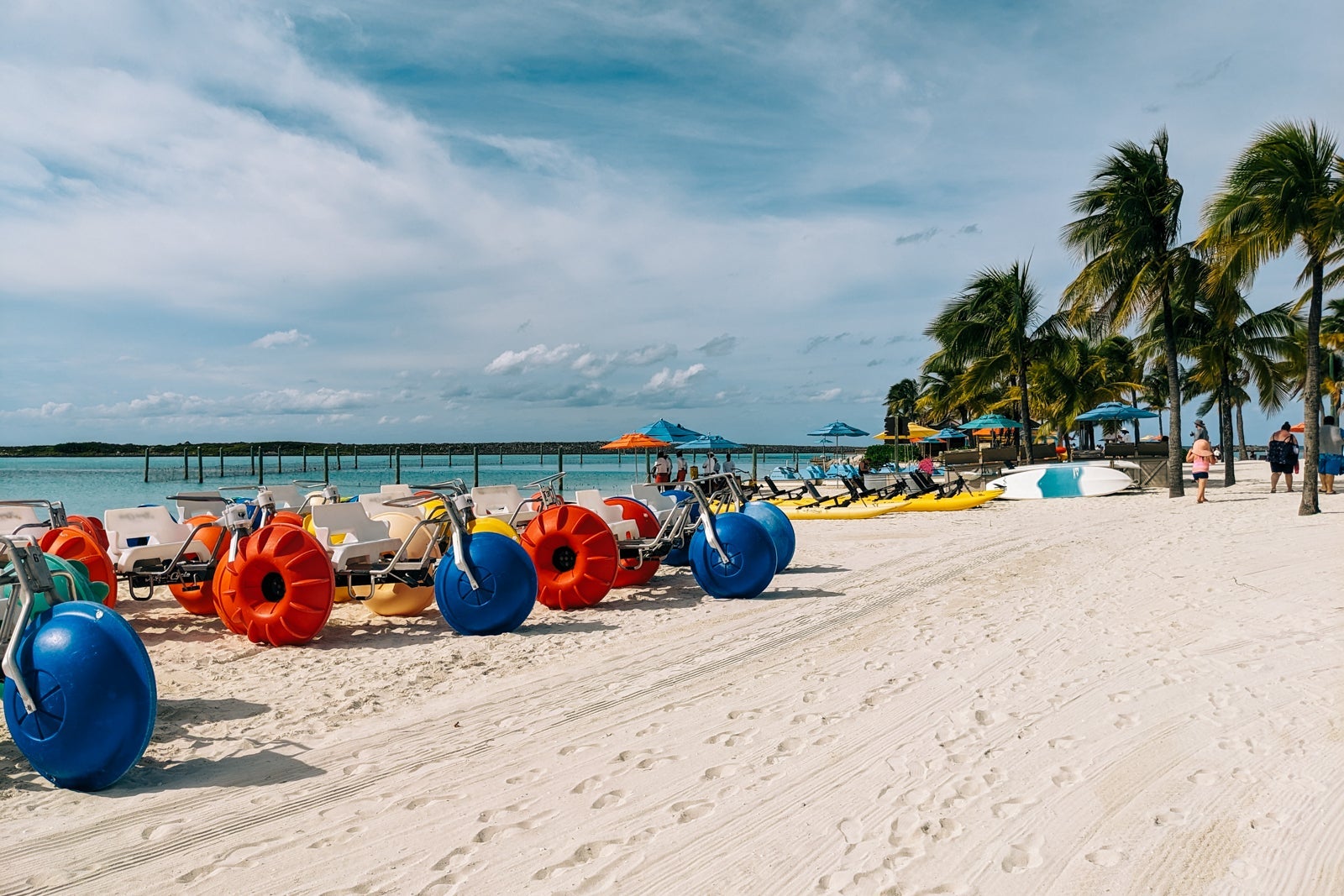 Rows of beach bikes and kayaks on the beach