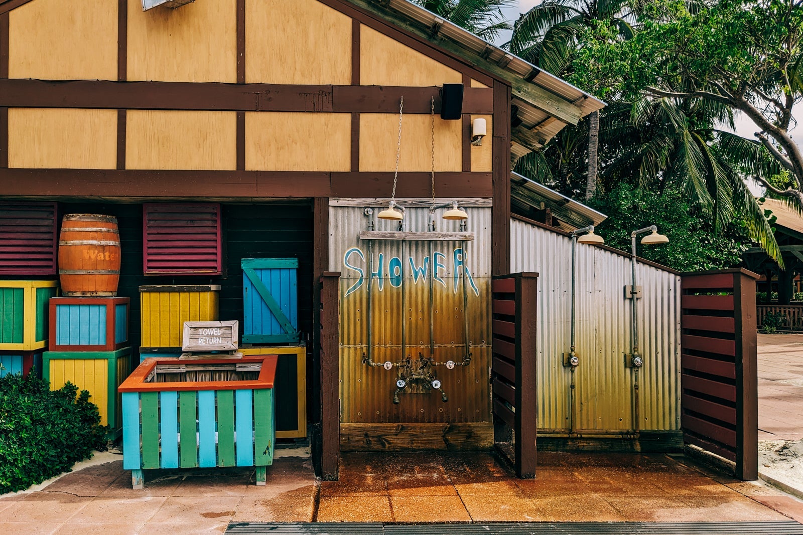 Bathroom hut with outdoor showers and towel return on Disney's private island.