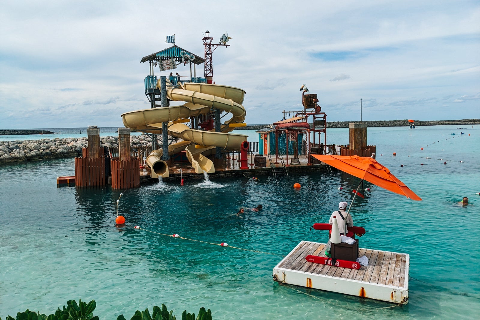 Raft with double water slide tower in Bahamian waters