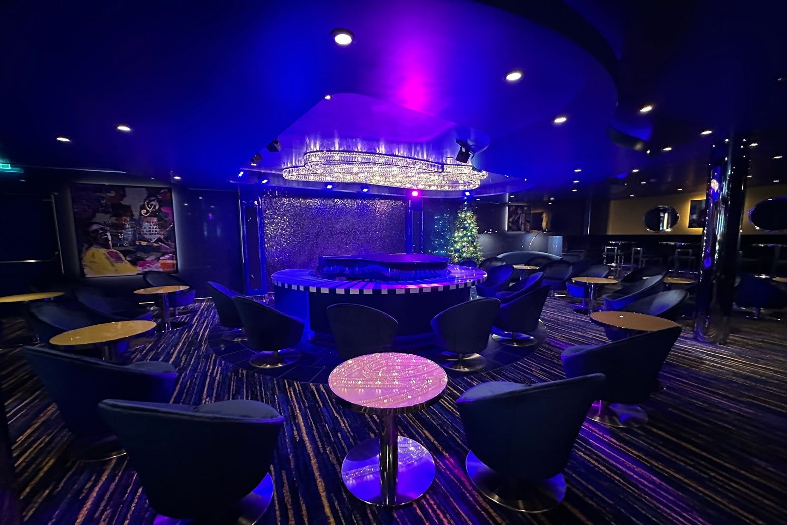 A piano bar awash in purple lighting