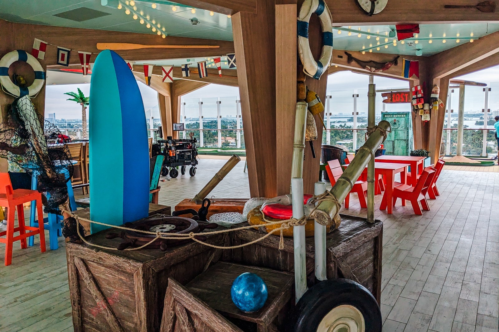 Basecamp decor of crates with surfboard