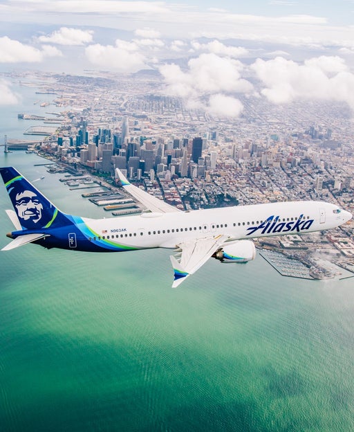 Alaska Airlines plane flying over water