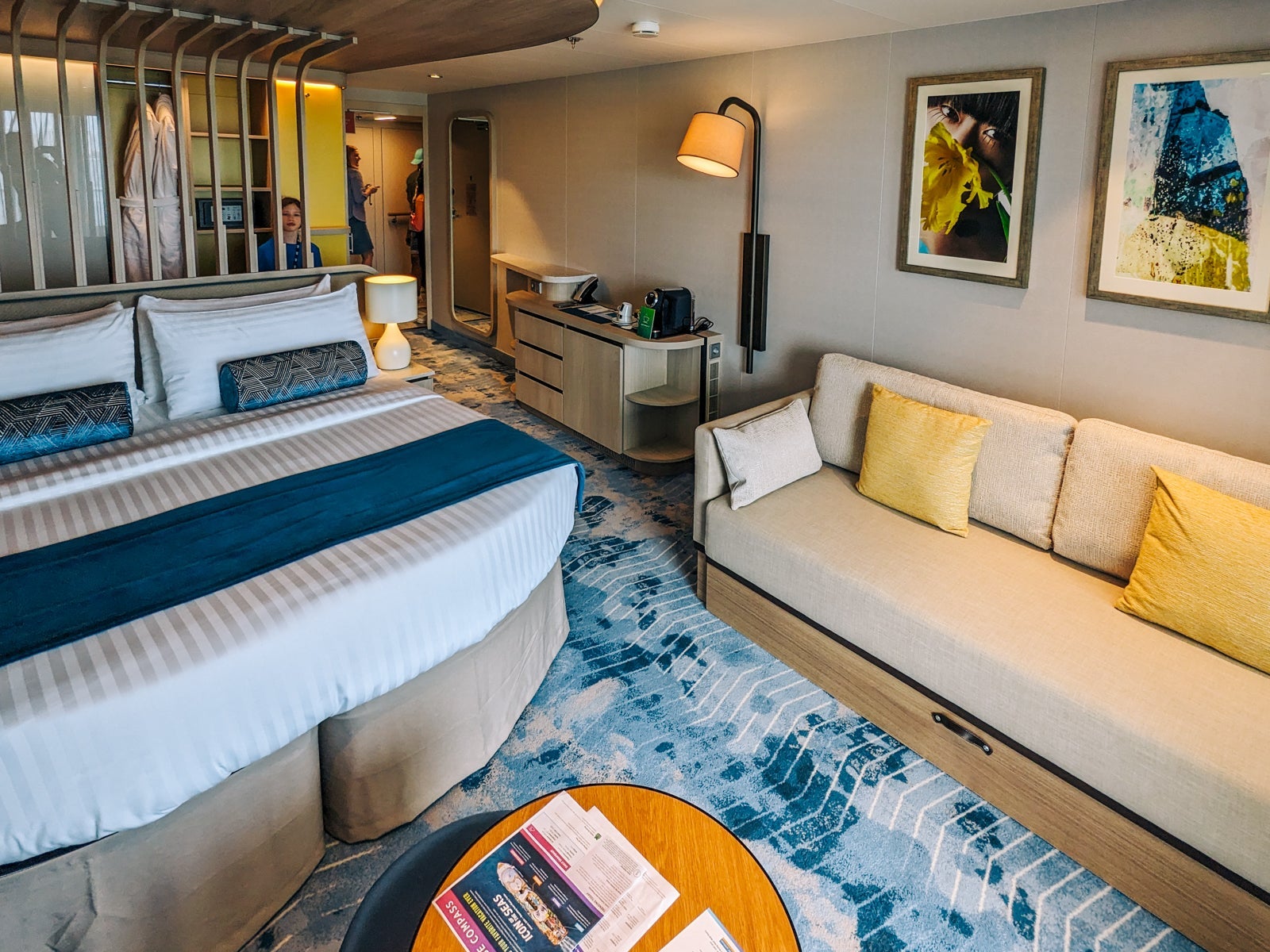 Cruise ship cabin with bed and couch