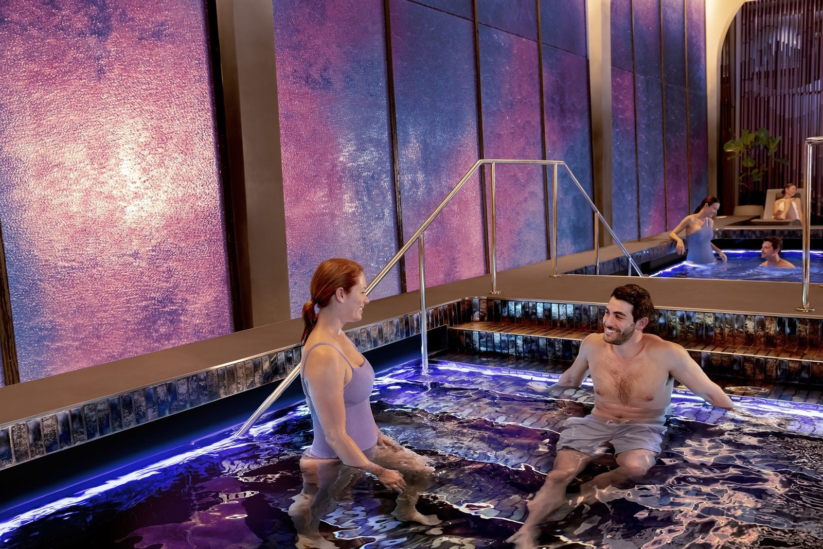 Passengers relax in the thermal pool in the spa on Norwegian Prima