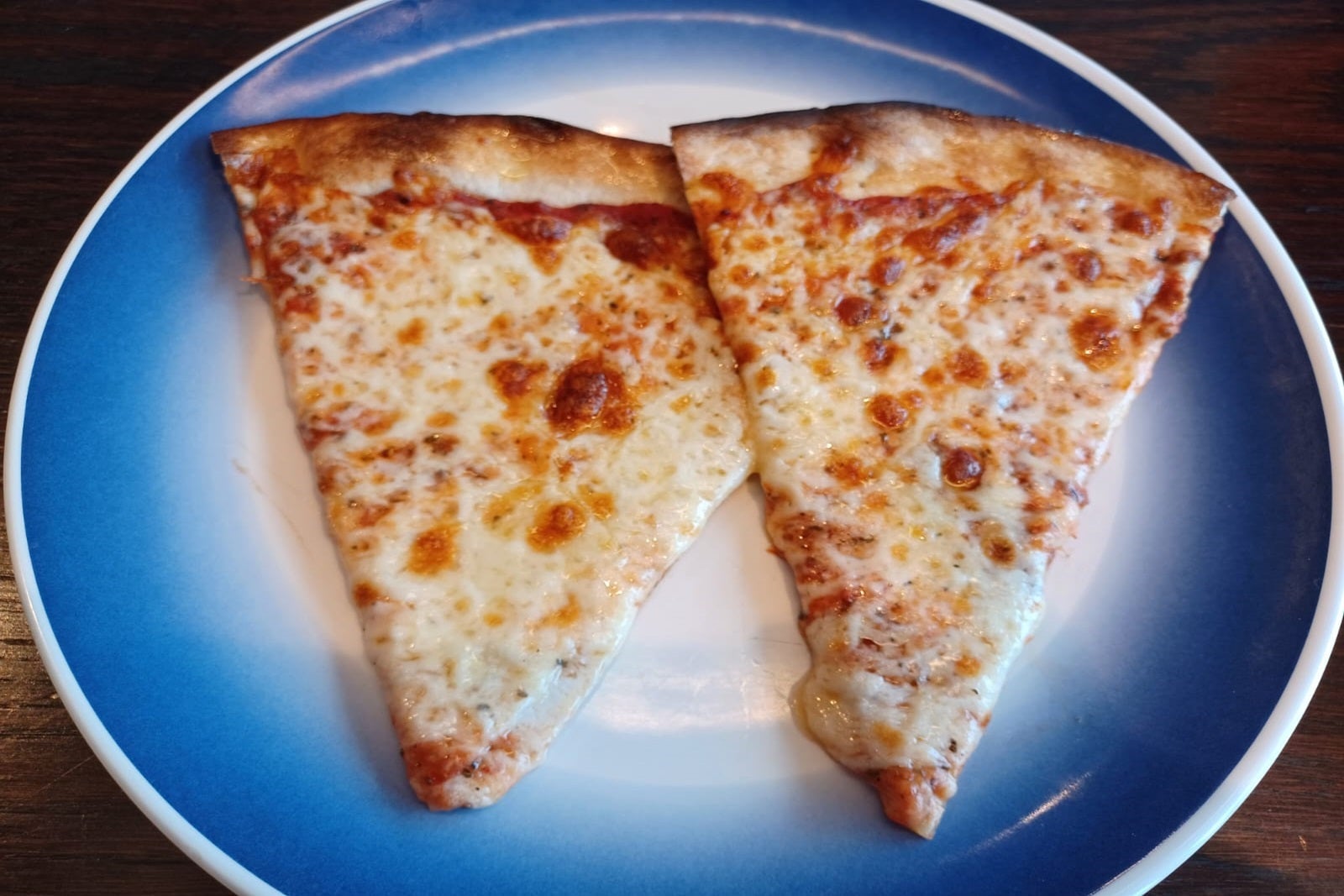 A plate with two slices of pizza