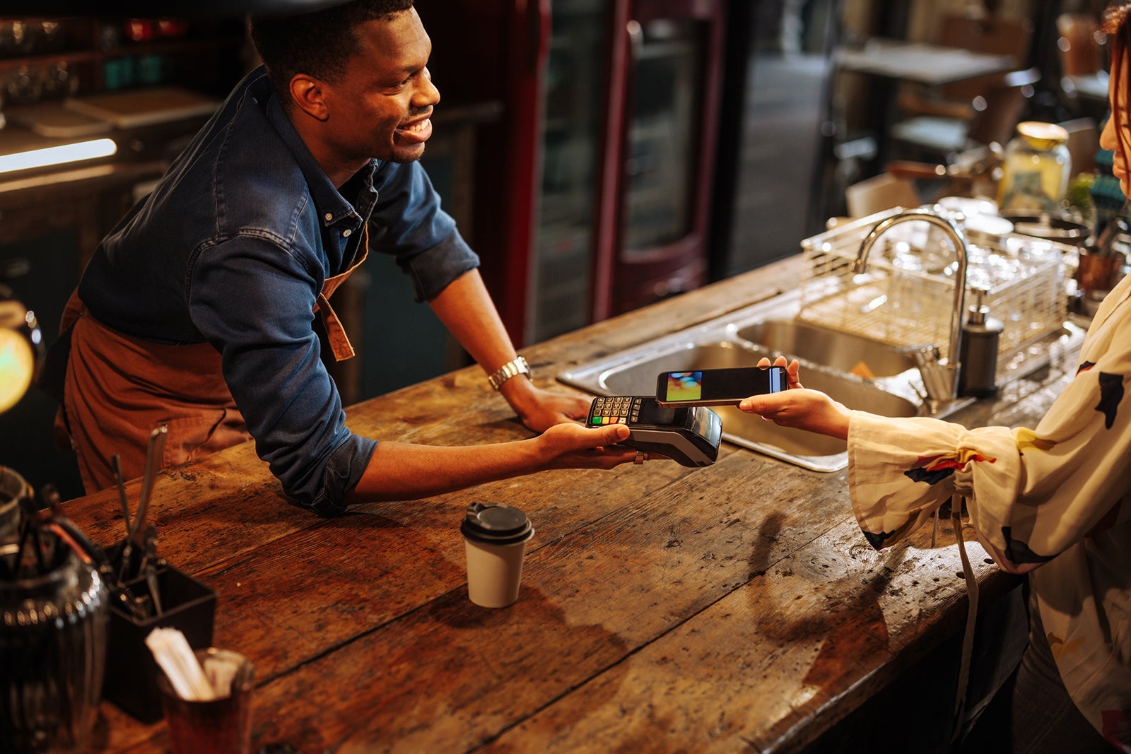 bartender accepting payment from a customer
