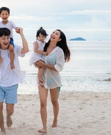 Family enjoying the beach at sunset
