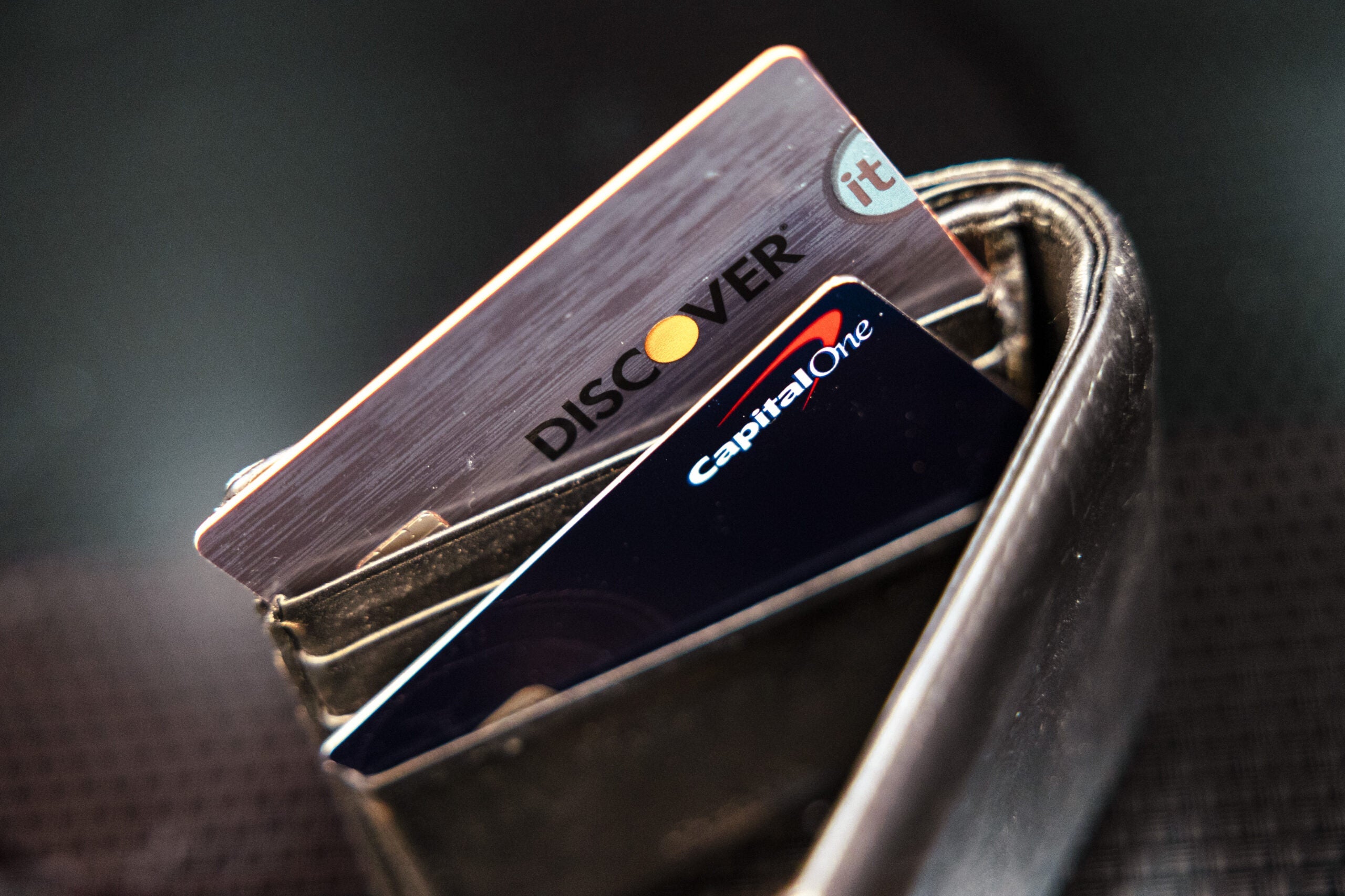Capital One and Discover credit cards arranged in Germantown, New York, US, on Tuesday, Feb. 20, 2024. ANGUS MORDANT/BLOOMBERG VIA GETTY IMAGES