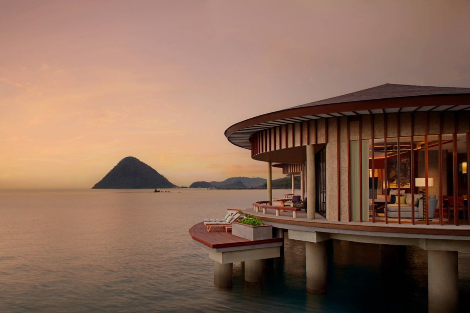 Overwater bungalow at sunset