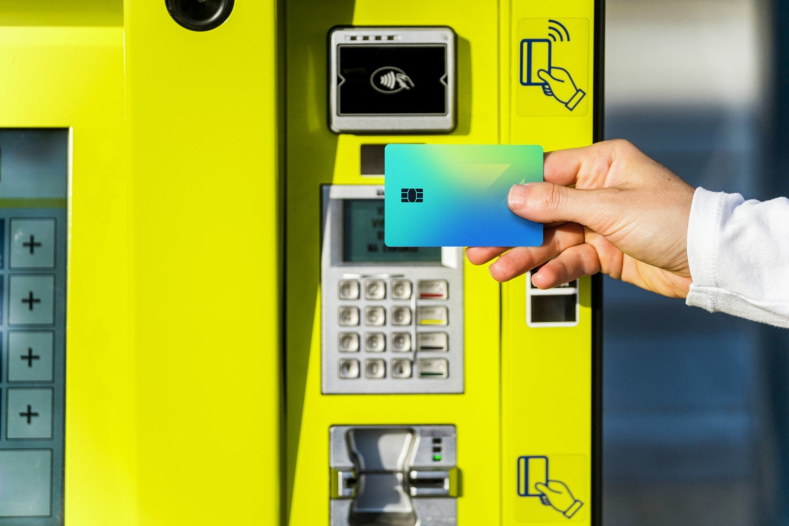 Person tapping card at the ATM