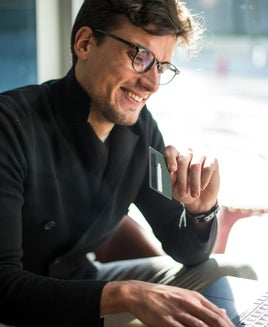 Smiling man shopping.