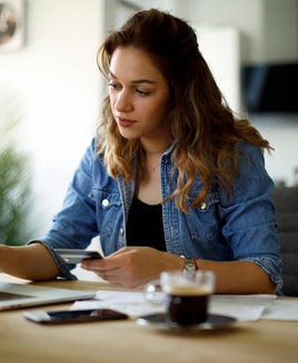 Woman paying bills at home
