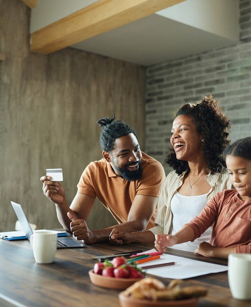 family smiling shopping online
